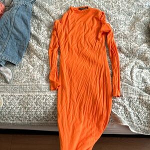 Orange midi bodycon dress.
